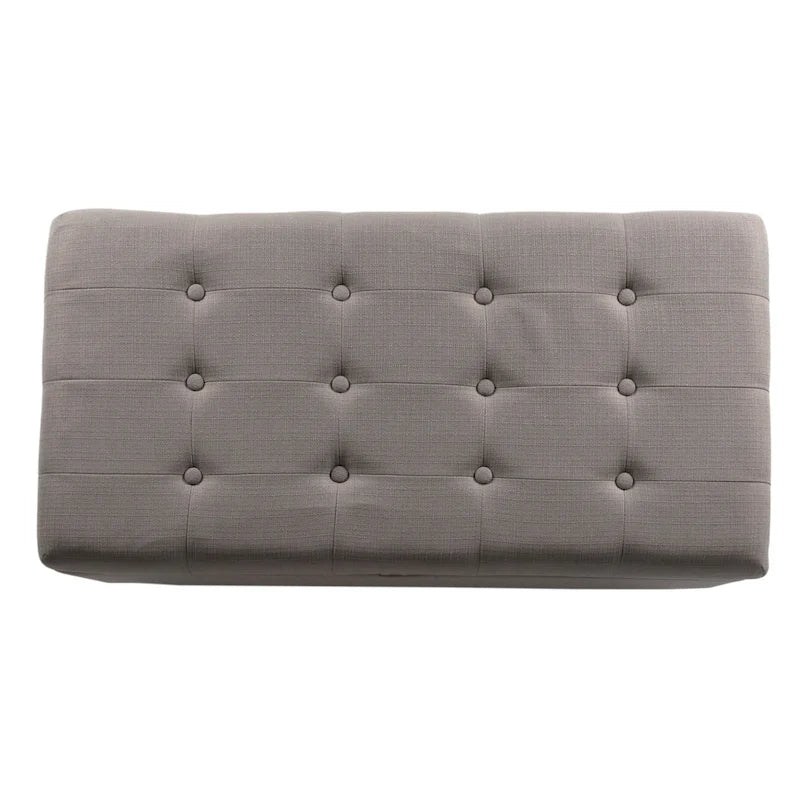 Banc de rangement gris capitonné